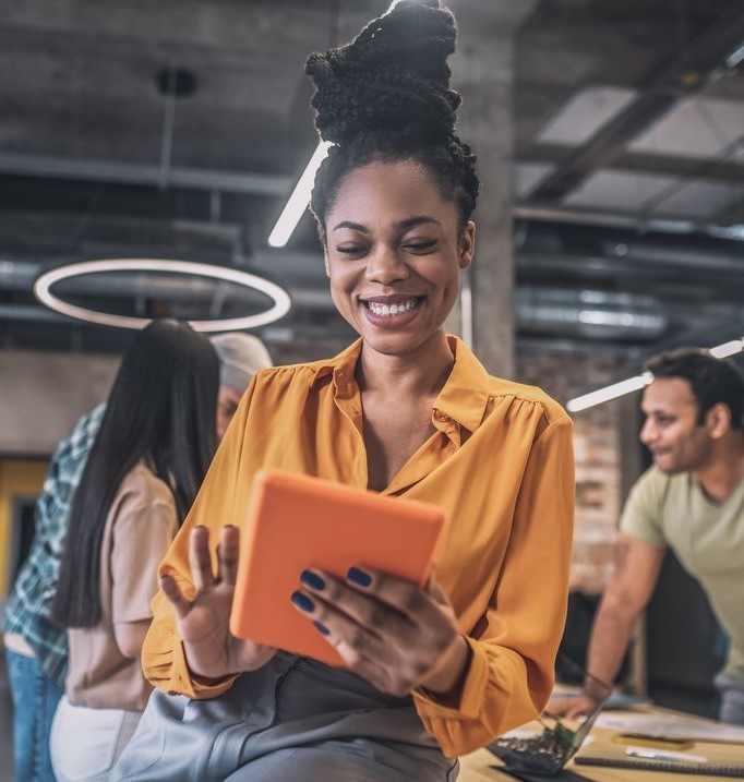 Smiling girl using tablet